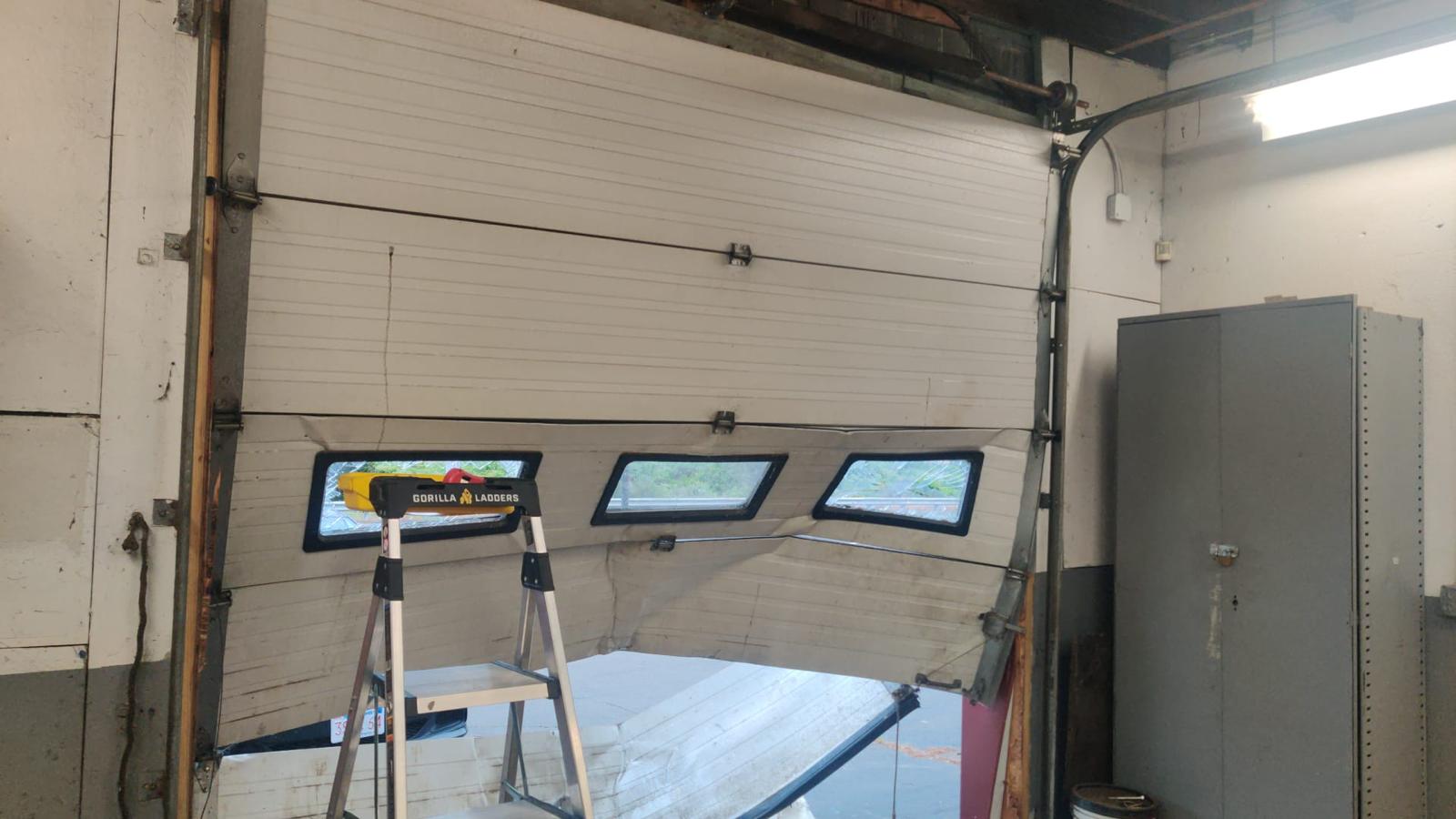 Commercial sectional garage door installation in progress